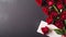Beautiful red rose flower bouquet and blank note paper on dark background, congratulations and anniversary concept, Valentine s