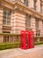 Beautiful red telephone box in the middle of the city center