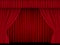 Beautiful red theatre folded curtain drapes on black background