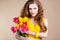 Beautiful redheared girl with bouquet of tulips