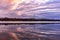 Beautiful reflection of the sky at sunset in the water on the river. Spring background