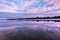 Beautiful reflection of the sky at sunset in the water on the river. Spring background