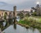 Beautiful reflections of the medieval bridge Besalu, Spain.