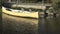 Beautiful reflections of a yellow boat drifting in a peaceful canal