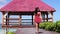 Beautiful relaxed woman leaving a dock of the beautiful caribbean sea under a tropical sun. Beach and relax