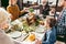 beautiful religious family holding hands and praying on thanksgiving before