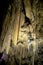 A beautiful Resava cave (Resavska pecina) in Serbia, massive columns of stalagmites and stalactites on the cave bottom.