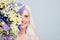 Beautiful retired woman beaming smile hide half face big bunch wild flowers nice smell isolated grey color background