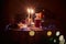 Beautiful retro holiday decor, birthday party. Burning candles and lights in the dark, Christmas