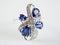 Beautiful ring with tanzanite stone lay on white background