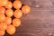 Beautiful ripe oranges on brown table