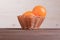 Beautiful ripe oranges on brown table