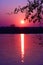 Beautiful rising sun reflected in the lake