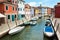 Beautiful river channel and streets with multicoloured houses, Burano island, Venice, Italy