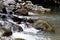 Beautiful River clear water flowing through stones and rocks