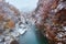 Beautiful river Flanked by mountains both side and it`s snowing