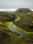 A beautiful river with a green moss and hills in clouds, Iceland