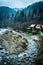 Beautiful river with houses on bank in mountains