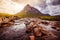 Beautiful river mountain landscape scenery in Glen Coe, Scottish Highlands, Scotland. Sunshine