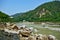 Beautiful River with mountains in the background and colorful houses in the sides of the river. Rishikesh a beautiful city in Indi