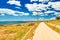 Beautiful road along the coastline of Syracuse. Former railway track, Sicily, Italy