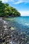 Beautiful rock beach with tourist long tail boat in Koh Hin Ngam, Tarutao National park, Thailand