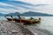 Beautiful rock beach with tourist long tail boat in Koh Hin Ngam, Tarutao National park, Thailand