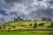 Beautiful Rock of Cashel castle with dramatic dark storm clouds in background