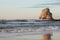 Beautiful rock cliff deux jumeaux in sunset sky on sandy beach of hendaye, basque country, france