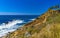 Beautiful rocks cliffs view waves at beach Puerto Escondido Mexico