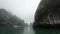 Beautiful rocks in Halong Bay on a cloudy rainy day