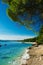 Beautiful rocky beach in Croatia with a view on Zlatni Rat or Golden Cape beach