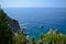 Beautiful rocky beach and some motorboats in Paleokastritsa, Greece