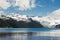 Beautiful Rocky mountain peaks towering over lake