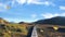 Beautiful rocky mountains and wooden walkway with blue sky.