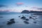 Beautiful rocky shoreline at Uttakleiv Beach in morning, Vestvagoy, Lofoten Islands archipelago, Norway.