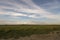 Beautiful Romanian llandscape with cows and one church in background