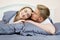 Beautiful romantic couple in bed, happy relationship, heterosexual couple