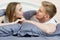 Beautiful romantic couple in bed, happy relationship, heterosexual couple