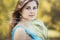 Beautiful romantic girl enjoying nature with fluffy feather grass in hands, young elegant woman face, bride in blue long dress