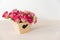 Beautiful romantic small bouquet of pink roses in wood box decor