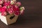 Beautiful romantic small bouquet of pink roses in wood box decor