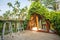 Beautiful rooftop bedroom with table and chair outside terrace with trees