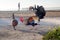 Beautiful rooster and chicken are looking for food in the sand on the beach.  Key West Island, Florida, USA