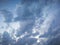 Beautiful rough white and grey clouds in blue sky at dusk