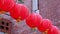 Beautiful round red lantern hanging on old traditional street, concept of Chinese lunar new year festival, close up. The undering