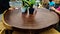 Beautiful round wooden dinner table displaysed in  shopping mall