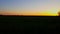 Beautiful rural countryside landscape at sunset with camera panning. Scenic country scene at dusk