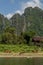Beautiful rural landscape with horses and ducks along the bank of the Nam Song river near Vang Vieng, Laos