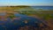 Beautiful Russian nature at sunset. View of the beach, forest and blue sea.